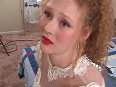 Find-Best-Lesbians.com presents: Redhead in wedding dress models her pussy