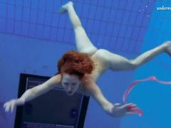 Find-Best-Lesbians.com presents: Curly hair redhead swims and looks sexy
