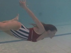 Find-Best-Lesbians.com presents: Leggy girl swims and strips naked in pool