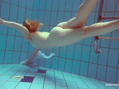 Find-Best-Lesbians.com presents: Redhead goes for a nude swim in the pool