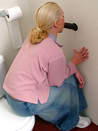Find-Best-Lesbians.com presents: Blonde girl Jamie sits on the toilet and blows a black gloryhole dong